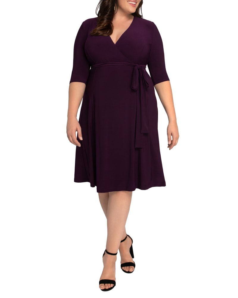 Front of a model wearing a size 0X Essential Wrap Dress in PLUM PASSION by Kiyonna. | dia_product_style_image_id:279178